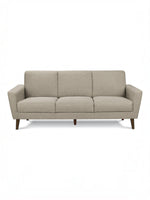 Canapé Tano beige en tissu de TOCO Meubles, 3 places, pieds en bois obliques, style moderne.