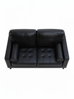 Causeuse Bryce TOCO Meubles en cuir noir avec assise capitonnée et accoudoirs cylindriques vue de dessus
