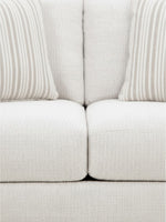 Causeuse Figaro TOCO Meubles en tissu texturé couleur givrée avec deux coussins décoratifs à rayures beiges