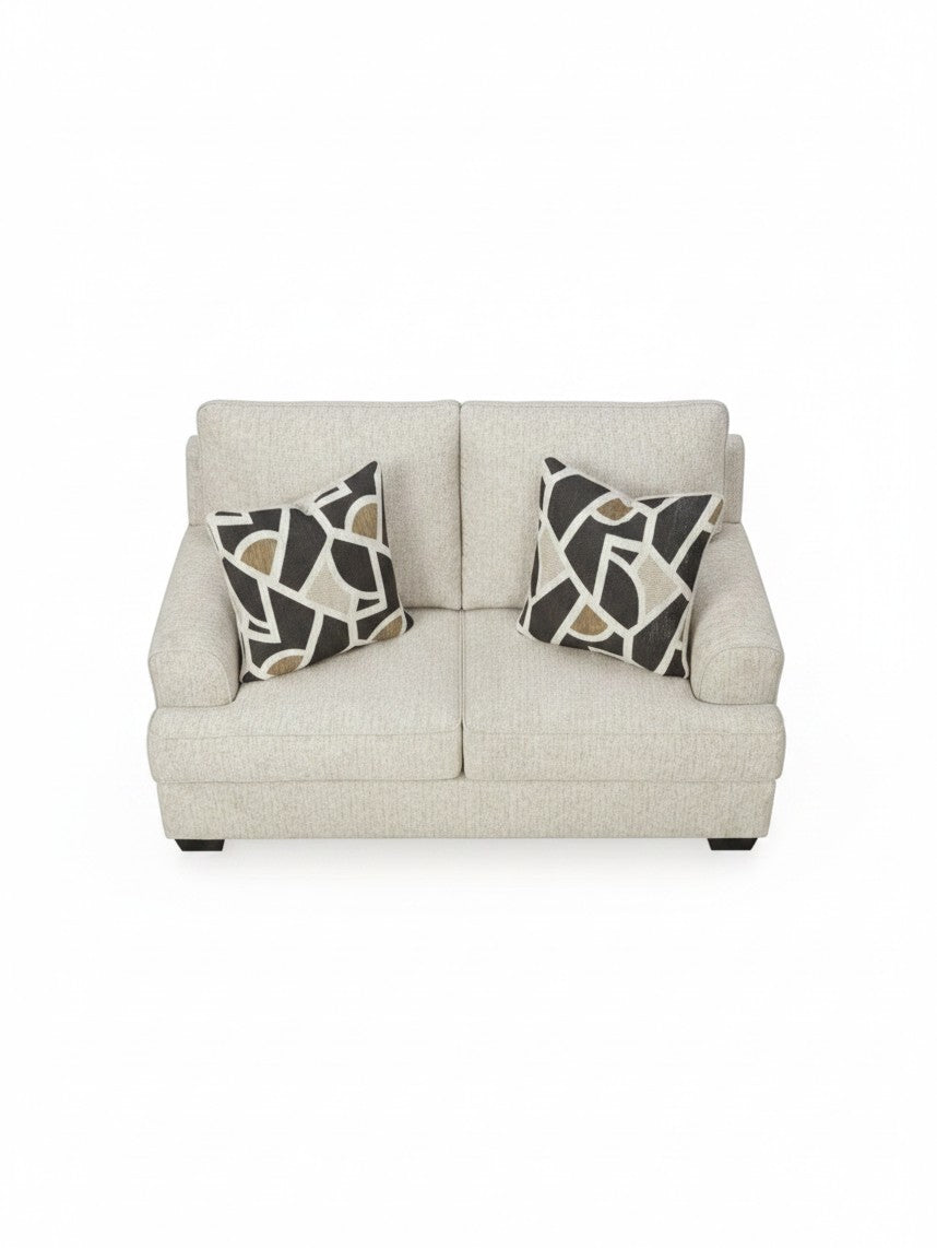 Causeuse Moka TOCO Meubles en tissu beige texturé avec deux coussins décoratifs à motifs géométriques