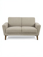 Causeuse Tano beige en tissu de TOCO Meubles, design moderne avec pieds en bois obliques.