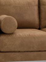 Causeuse Telora TOCO Meubles en cuir caramel avec coussin cylindrique et surpiqûres détaillées
