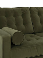 Causeuse TOCO Meubles Revo en velours vert olive avec dossier capitonné et coussin cylindrique