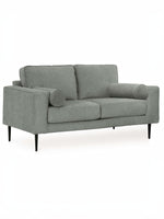 Causeuse Zela de TOCO Meubles en tissu gris anthracite avec coussins cylindriques et pieds noirs modernes