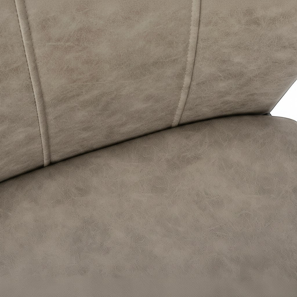 Chaise de salle à manger taupe Baxter de TOCO Meubles, revêtement effet suède, base métal noir, design moderne sans accoudoirs.