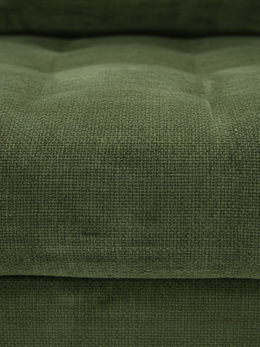 Gros plan sur le tissu vert texturé de la chaise longue en coin Bixo de TOCO Meubles