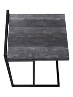 TOCO Meubles Eliott C-shaped side table with dark grey wood-effect top and black metal frame