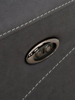 TOCO Meubles Sofa inclinable Elvis gris avec boutons de commande chromés et coutures contrastantes.
