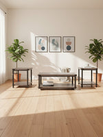 Ensemble de trois tables Wilma TOCO Meubles avec plateaux gris et pieds noirs dans un salon lumineux