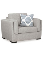 Fauteuil TOCO Meubles Evan gris en tissu avec coussin décoratif à motifs géométriques bleus et blancs