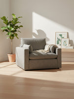 Chaise Faro TOCO Meubles gris granite, fauteuil large et confortable avec coussins dans un salon lumineux