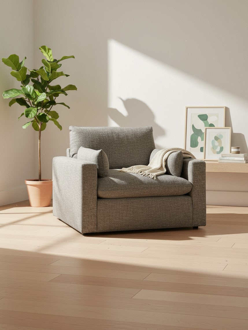 Chaise Faro TOCO Meubles gris granite, fauteuil large et confortable avec coussins dans un salon lumineux