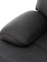 Fauteuil inclinable Elvis noir en similicuir de TOCO Meubles, avec surpiqûres contrastantes et accoudoir rembourré.