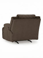 Fauteuil inclinable Enzo de TOCO Meubles en tissu brun chocolat avec dossier texturé pour un confort optimal.