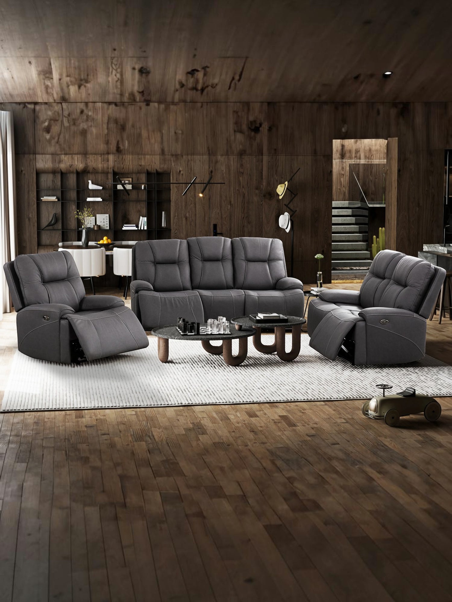 Fauteuil inclinable gris foncé en cuir, 1 place, avec repose-pieds relevé. Fauteuil Elvis par TOCO Meubles.