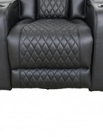Fauteuil inclinable Warren noir TOCO Meubles en cuir avec surpiqûres en losange et porte-gobelets intégrés.