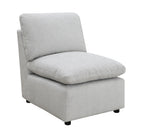 TOCO Meubles - Fauteuil modulaire gris clair en tissu texturé avec coussins moelleux et pieds discrets.
