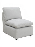 TOCO Meubles - Fauteuil modulaire gris clair en tissu texturé avec coussins moelleux et pieds discrets.