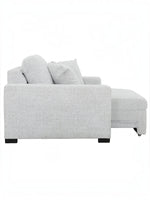 Fauteuil d'appoint TOCO Meubles Sacha en tissu gris pâle avec repose-pieds intégré, vue de profil
