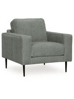 Fauteuil Zela gris en tissu avec pieds noirs fins, design moderne par TOCO Meubles
