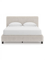 Grand lit Chloe TOCO Meubles en tissu texturé côtelé gris clair, design contemporain et chic.