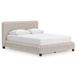 Grand lit Chloe TOCO Meubles en tissu gris texturé côtelé, design contemporain et chic.