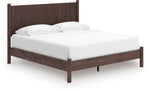 Lit Alma grand format en bois brun foncé de TOCO Meubles avec tête de lit cannelée et pieds ronds.