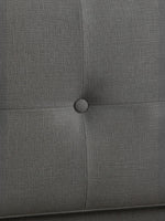 Gros plan sur la tête de lit capitonnée en tissu gris du lit double Bianca par TOCO Meubles