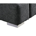 Lit grand format Billie TOCO Meubles en tissu gris foncé avec pieds carrés blancs discrets.