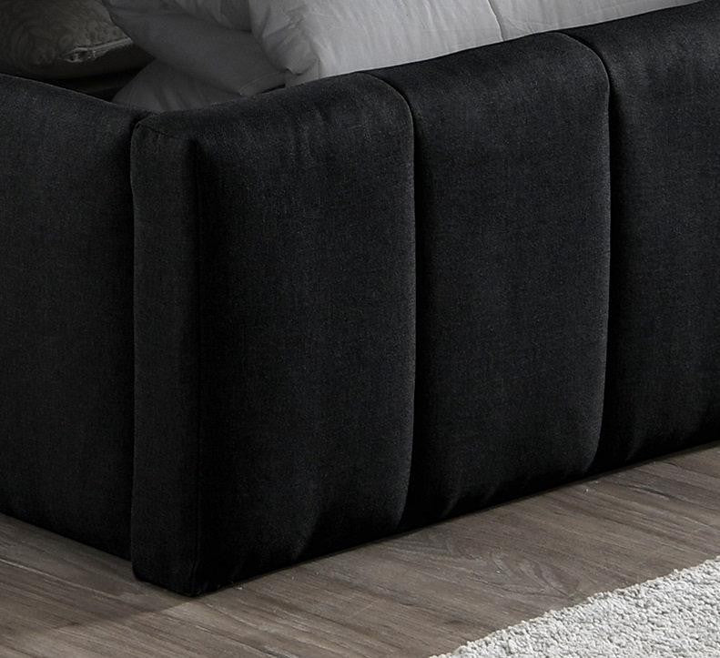 Lit Colette TOCO Meubles noir en tissu avec capitonnage vertical, idéal pour chambre moderne avec rangement intégré.