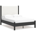 Lit double Margot TOCO Meubles avec tête de lit rembourrée blanche texturée et cadre en bois sombre.