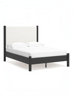 Lit double Margot TOCO Meubles avec tête de lit rembourrée blanche texturée et cadre en bois sombre.