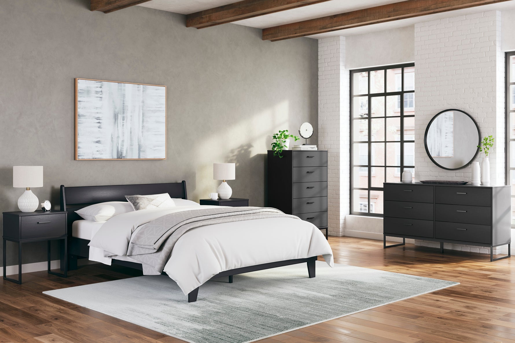 Lit double noir en bois de style contemporain, marque TOCO Meubles, avec tête de lit incurvée et pieds fuselés.