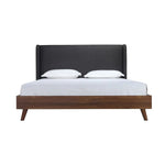 Lit King Cesar TOCO Meubles avec tête de lit haute rembourrée en tissu gris foncé et cadre en bois imitation noyer.