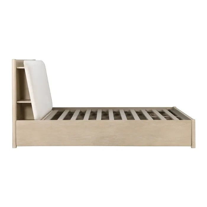 Grand lit Laurent TOCO Meubles en chêne clair avec tête de lit rembourrée couleur huître et rangements intégrés.