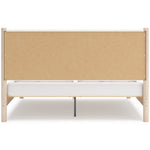 Lit Margot TOCO Meubles en bois clair avec tête de lit rembourrée blanche texturée, style boho minimaliste.