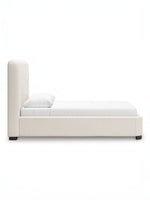 Lit Paloma TOCO Meubles très grand, rembourré en tissu bouclé crème, avec tête de lit enveloppante et pieds discrets.