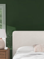 Grand lit Paloma TOCO Meubles en tissu texturé crème avec tête de lit ailée, ambiance moderne et cosy.