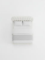 Très grand lit Perla TOCO Meubles blanc rembourré avec tête de lit capitonnée vue de dessus sur fond blanc