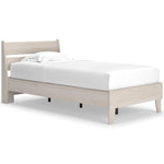 Lit simple Solene en bois clair de TOCO Meubles, design contemporain avec tête de lit incurvée et pieds fuselés.