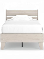 Lit simple Solene en bois clair avec tête de lit à lattes et sommier blanc par TOCO Meubles