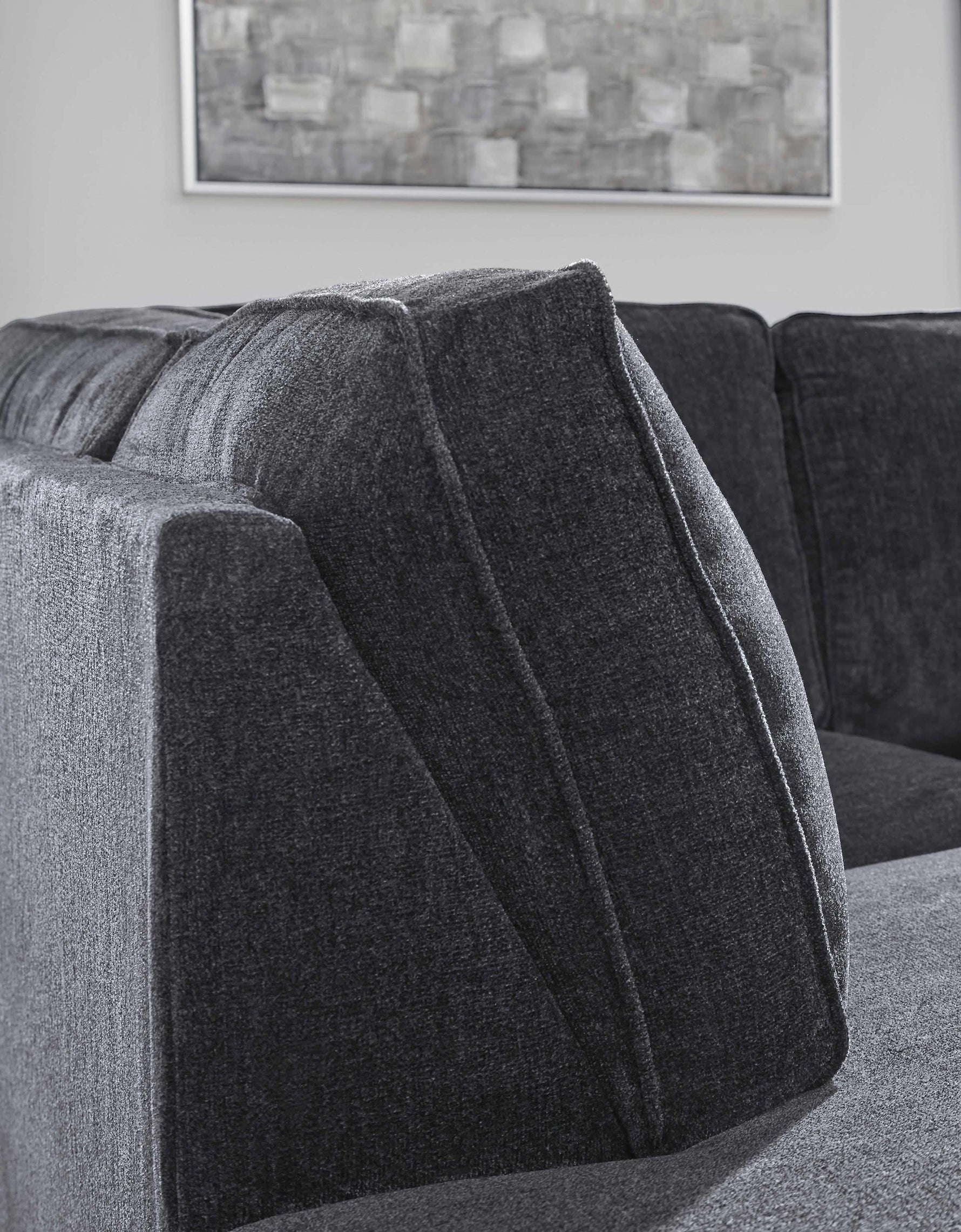 TOCO Meubles Sofa-lit sectionnel Marcel gris foncé en tissu avec coussins texturés et design moderne.