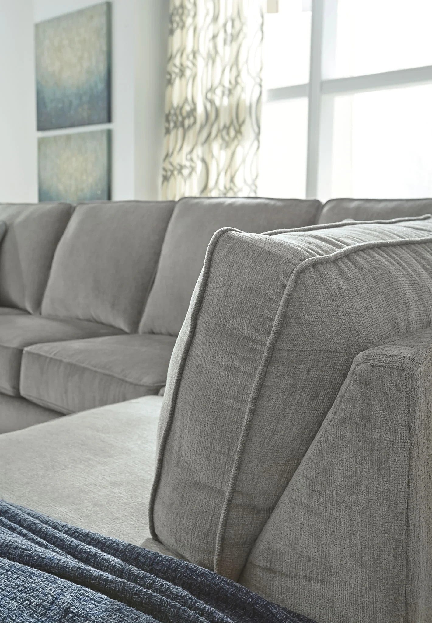 TOCO Meubles Sofa-lit sectionnel Marcel gris en tissu, coussins moelleux, design moderne et confortable.