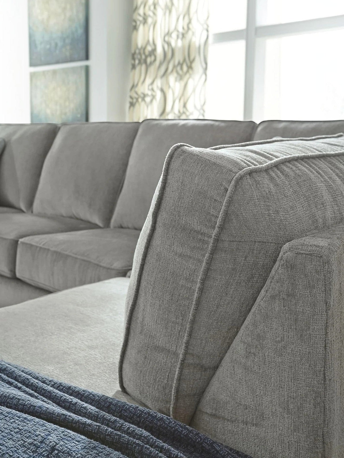 TOCO Meubles Sofa-lit sectionnel Marcel gris en tissu, coussins moelleux, design moderne et confortable.