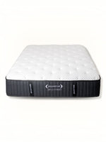 Matelas Ariya Hybrid TOCO Meubles avec surface matelassée blanche et contours noirs, technologie hybride confortable.