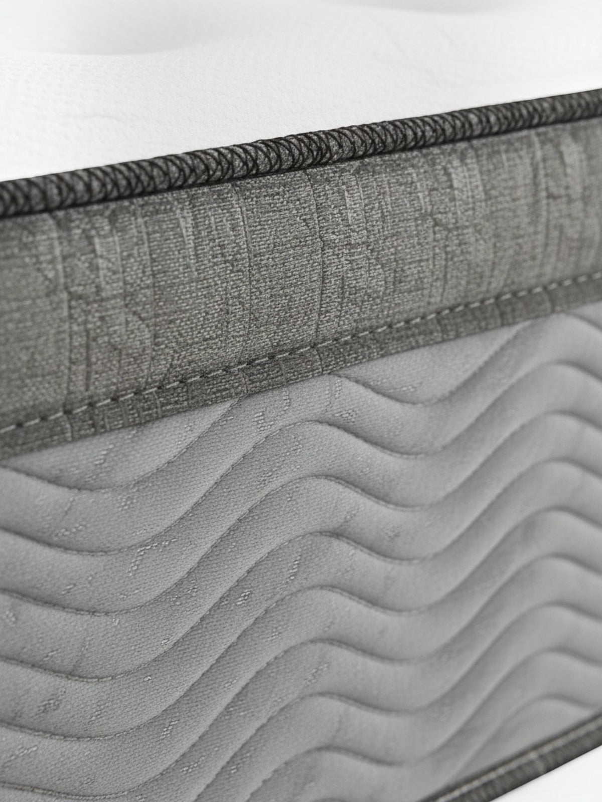 Gros plan sur la finition texturée et les coutures élégantes du matelas Back Care Quartet Grand de TOCO Meubles