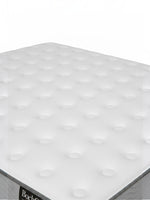 Matelas ferme TOCO Meubles BackCare Duo avec ressorts ensachés et surface blanche capitonnée