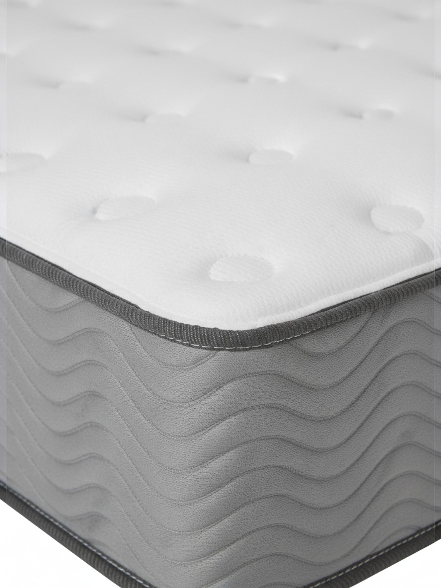 Matelas ferme BackCare Duo TOCO Meubles avec surface blanche capitonnée et bordure latérale grise ondulée