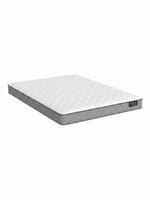 Matelas BackCare Solo de TOCO Meubles avec surface blanche matelassée et bordures grises, offrant un soutien ferme.