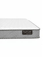 Matelas BackCare Solo de TOCO Meubles avec surface blanche matelassée et bordure grise texturée en chevron